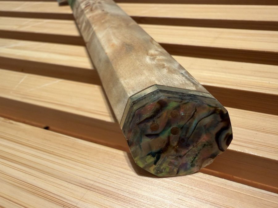 Back of the handle: paua abalone and brass pins